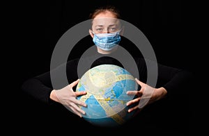 Woman hands holding the Earh globe in the hands