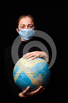 Woman hands holding the Earh globe in the hands