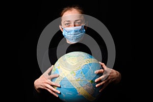 Woman hands holding the Earh globe in the hands