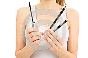 Woman hands holding make up equipment