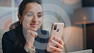 Woman hands holding mobile phone at modern office closeup. Happy lady relaxing