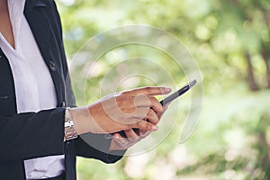 Woman hands holding mobile phone outdoor surfing internet online technology lifestyle. Close up woman hand using smartphone gadget