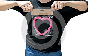 Woman hands holding a package of chalk board with pink heart frame