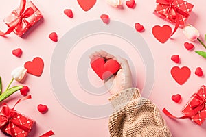 Woman hands holding red heart and have gift or present box decorated surprise
