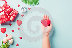 Woman hands holding red heart and have gift or present box decorated surprise