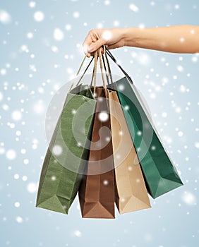 Woman hands holding shopping bags