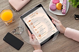 Woman hands holding tablet computer with app tracking delivery p