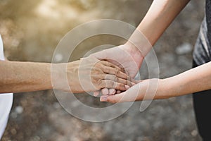 Woman hands holding to elderly with alzheimer disease at home,Adult social care concept