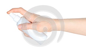 Woman hands holding a white spray bottle, isolated on transparent background close-up, template for cosmetics ads