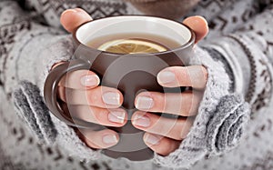 Woman hands with hot drink