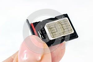 Woman hands inserting the phone sim card into the tray from the smartphone close up.