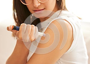 Woman, hands and insulin injection in arm for diabetes, medical condition and treatment at home. Needle, medication and