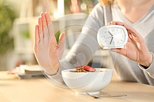 Woman hands on intermittent fasting doing stop sign