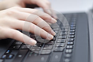 Woman hands on the keyboard