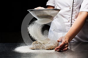 Woman hands kneading dough