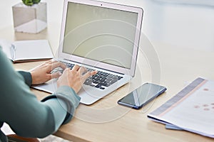 Woman hands, laptop mockup and typing, planning and working receptionist desk in modern office. Closeup keyboard