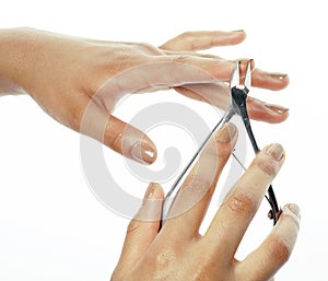 Woman hands making no qualified manicure to