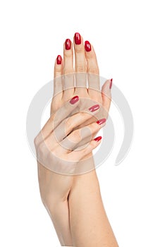 Woman hands with manicured red nails