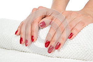 Woman hands with manicured red nails