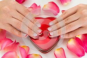 Woman Hands With Nail Varnish On Make-up Box