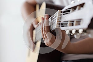 Woman hands playing acoustic classic guitar the musician of jazz and easy listening style select focus shallow depth of field and