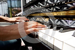 Woman hands playing piano