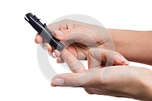 Woman hands poking finger to check glucose or blood sugar level