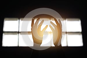 Woman hands praying for blessing from god in room on dark background