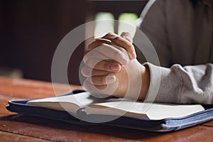 Woman hands praying to god with the bible. begging for forgiveness and believe in goodness. Christian life crisis prayer to god