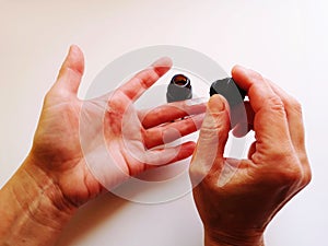 Woman hands put gel for warts