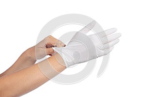 Woman hands putting on a latex gloves photo