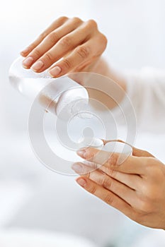 Woman Hands Putting Liquid From Bottle To Lens Box