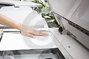 Woman hands putting a sheet of paper