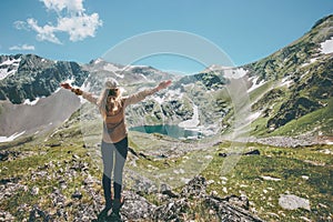 Woman hands raised enjoying landscape mountains and lake Travel Lifestyle adventure