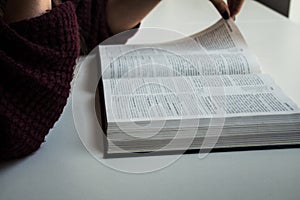 Woman hands reading bible