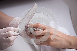 Woman hands receiving a manicure