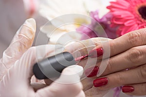 Woman hands receiving a manicure