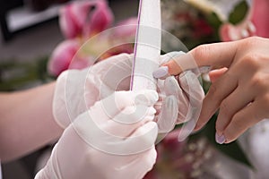 Woman hands receiving a manicure