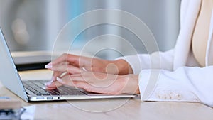 Woman hands rushing to meet a deadline. Closeup of a typing admin clerk working on a schedule in an office. Professional