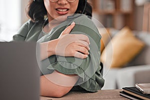 Woman, hands and shoulder pain in remote work from injury, stress or burnout at home office. Closeup of female person