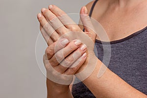 Woman hands showing numb hand
