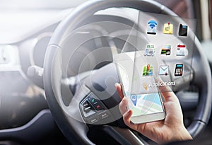 Woman, hands and smartphone with hologram in car with digital maps for smart driving and assist with navigation. Person