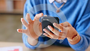 Woman, hands and smartphone for typing, connection and communication with social media, chatting and sms. Closeup, hand