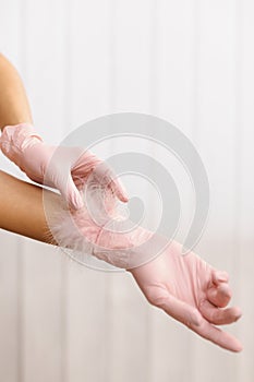 Woman Hands With Soft Feather. Body Care. Feather to female hand on white background. Concept of lightness easing and