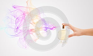 Woman hands spraying perfume