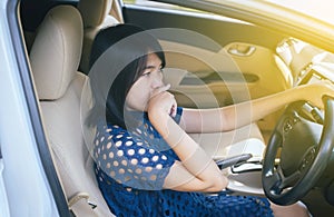 Woman hands squeeze and touching her nose with of bad smell in a car