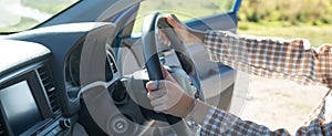 Woman hands on steering wheel