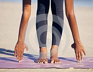 Woman, hands and stretching with mat on beach in yoga exercise, training or outdoor workout in nature. Closeup of female