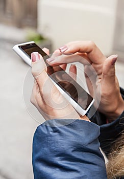 Woman hands with telephone close up image