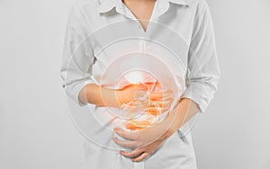 Woman hands touching belly and stomach painful suffering from chronic gastritis on white background. Healthcare concept.